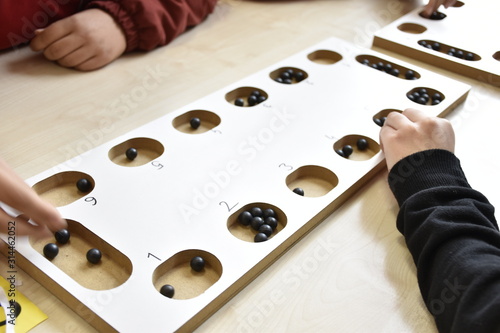 A table game of a beige color on a table: 