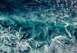Aerial view to waves in ocean Splashing Waves. Blue clean wavy sea water. Seething waves with foam.