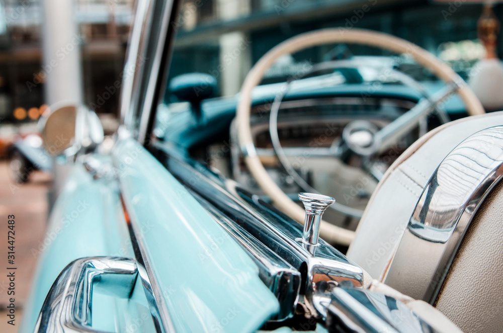 Interesting beautiful design of retro car with original wheel driving, the sensors and door handles.