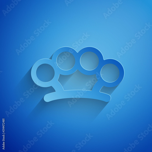 Paper cut Brass knuckles icon isolated on blue background. Paper art style. Vector Illustration