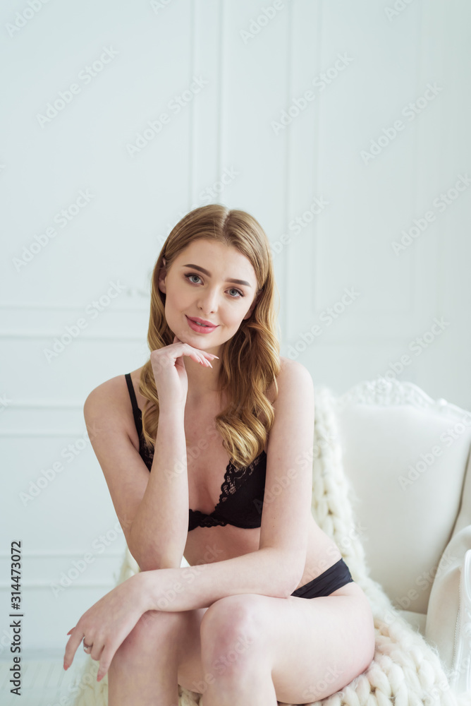 Portrait of sensual woman wearing underwear near window Portrait of sensual woman wearing underwear near window