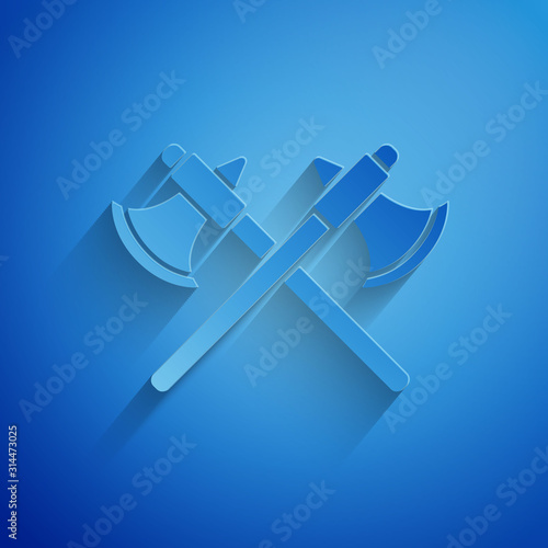 Paper cut Crossed medieval axes icon isolated on blue background. Battle axe, executioner axe. Paper art style. Vector Illustration