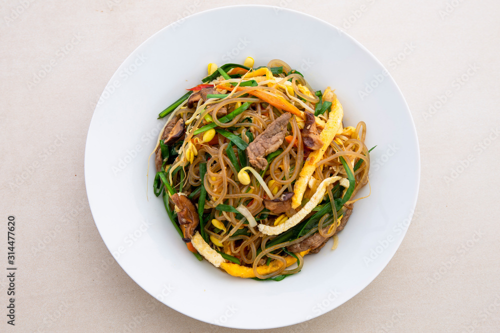 Stir fried Korean glass noodle with soy sauce called Japchae