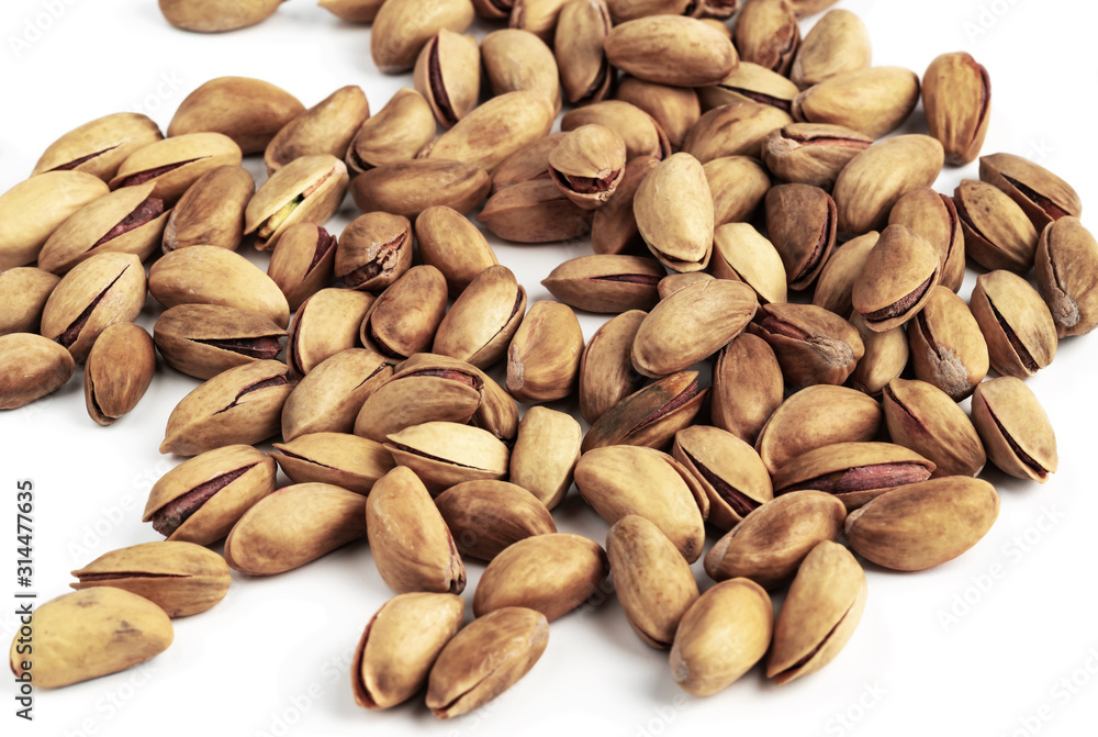 Pile of pistachios isolated on white background. Pistachio nuts Pile of pistachios isolated on white background. Pistachio nuts