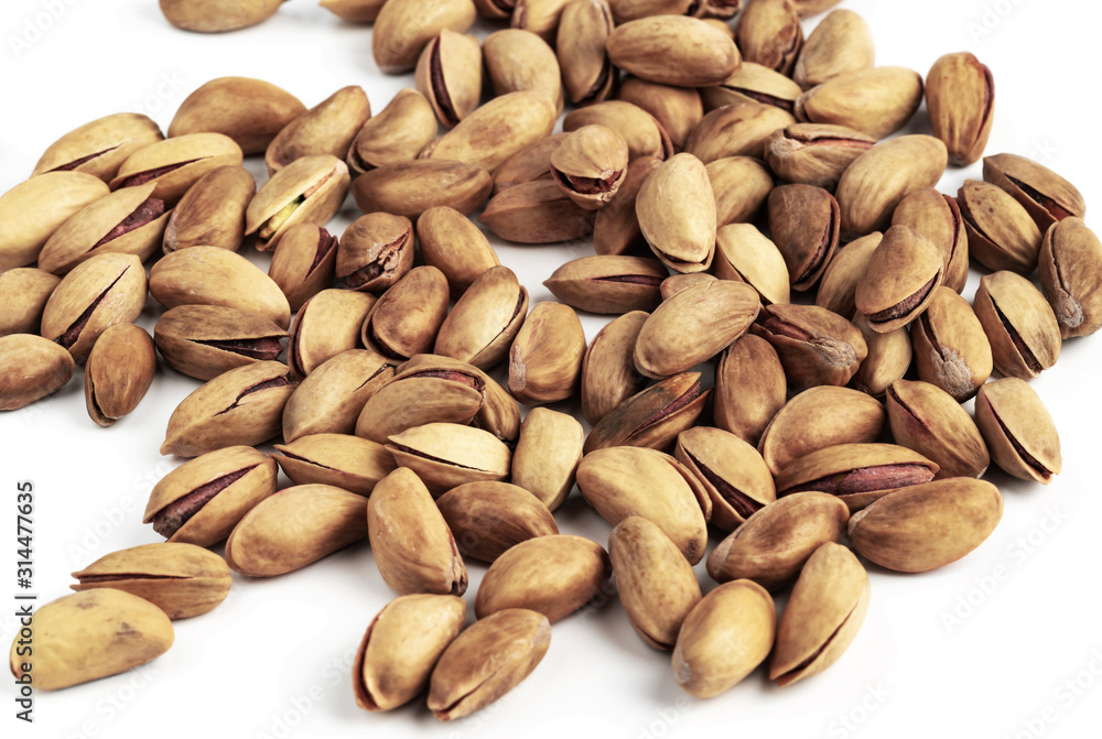 Pile of pistachios isolated on white background. Pistachio nuts