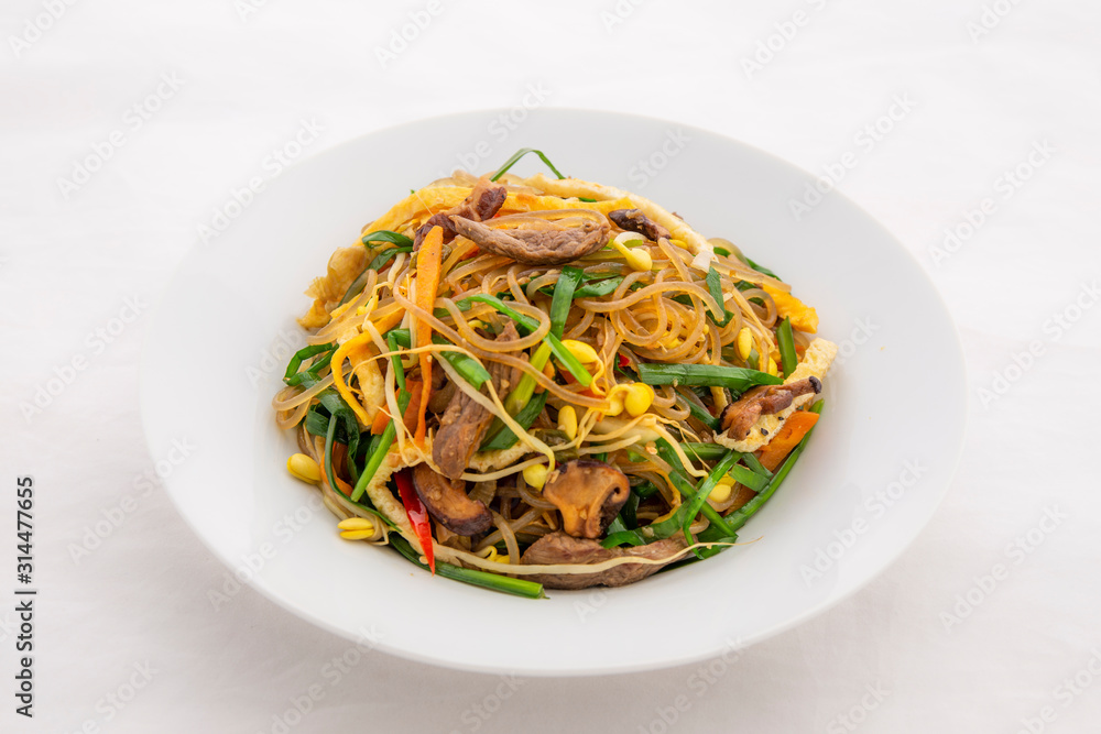 Stir fried Korean glass noodle with soy sauce called Japchae Stir fried Korean glass noodle with soy sauce called Japchae