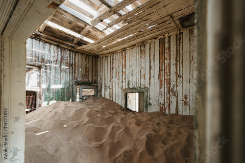 Desert sand entering old abandoned building and decay