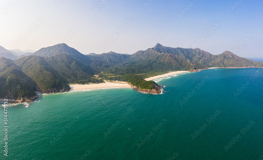Aerial view of the stunning Sai Kung peninsula with remote beaches and the sharp peak in Hong Kong new territories