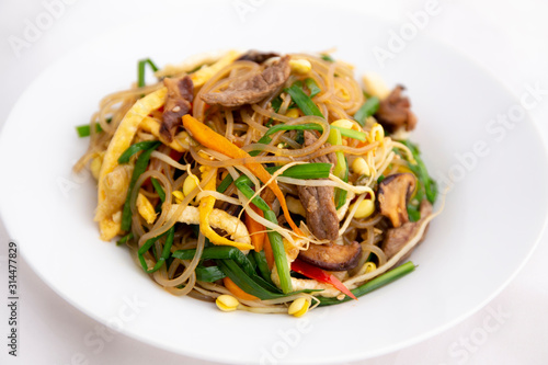 Stir fried Korean glass noodle with soy sauce called Japchae