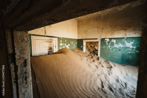 Desert sand entering old abandoned building and decay