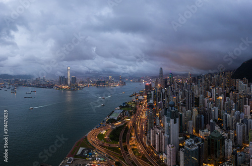 Dramatic sky over Hong Kong island Central distict and the Victoria harbor.