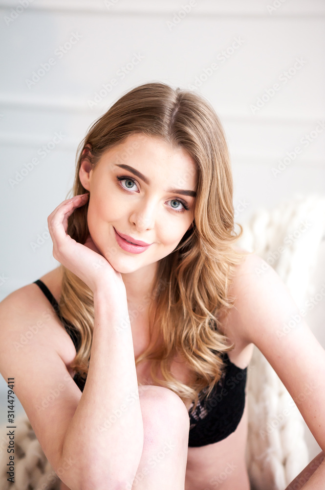 Pretty smiling girl underwear portrait near the window Pretty smiling girl underwear portrait near the window