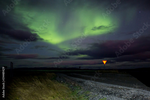 Beautiful landscape with Aurora borealis taken in Iceland on a clear sky night