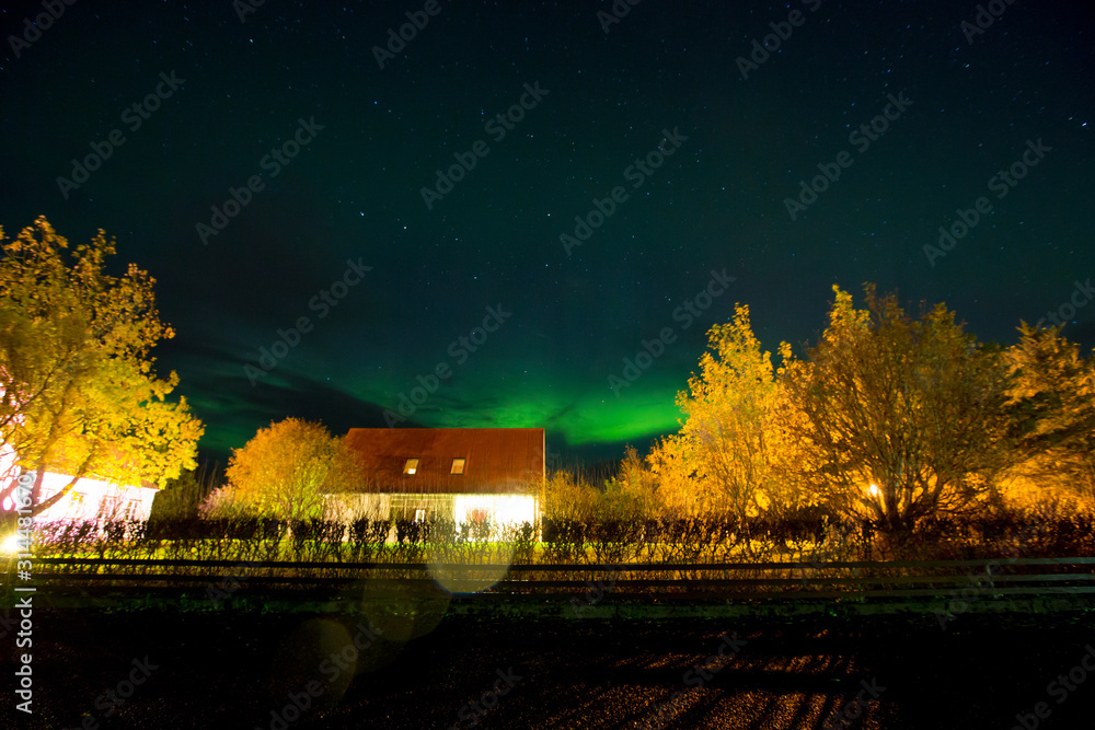 Beautiful landscape with Aurora borealis taken in Iceland on a clear sky night