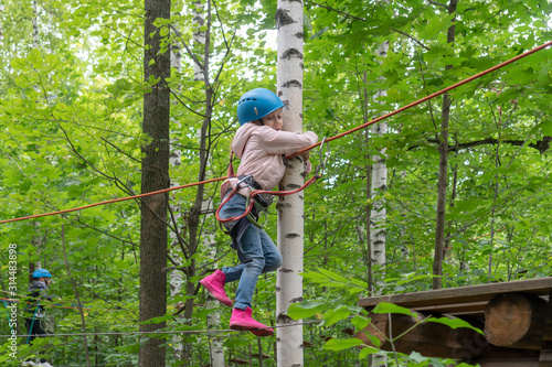 Wall Mural The child is afraid of heights. girl is afraid to fall down