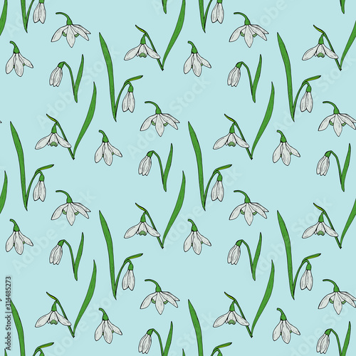 Seamless background with snowdrops on light blue background. Endless pattern for your design.