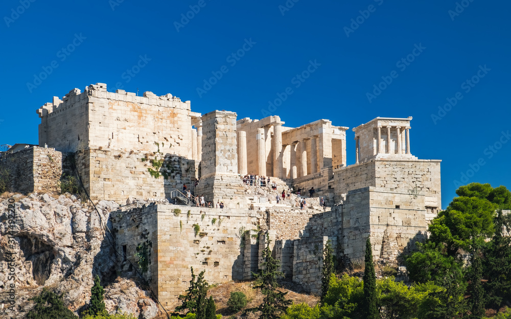 Tourists enjoying Parthenon temple on the Acropolis of Athens, view from the sightseeing point of Areopagus hill in Plaka