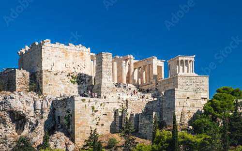 Tourists enjoying Parthenon temple on the Acropolis of Athens, view from the sightseeing point of Areopagus hill in Plaka