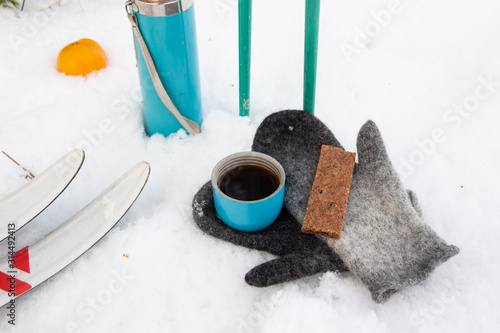 Energy cereal and fruit bar with coffee cup while skiing pause