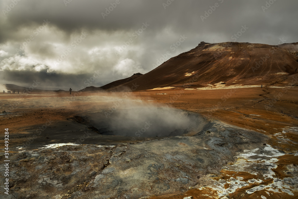 Valley with geothermal springs and geysers. Fantastic view of the hills and the current hot springs. Geothermal zones a Naumafjal Hverir in the north-eastern part of Iceland.
