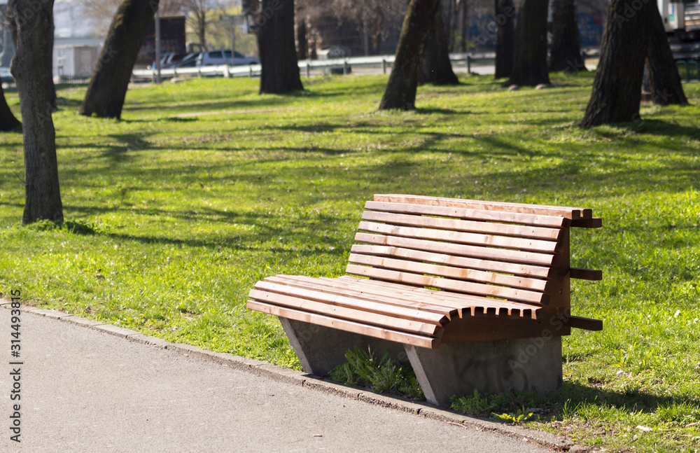 Wooden benches in the park beside to the hiking trails. Wooden benches in the park beside to the hiking trails.