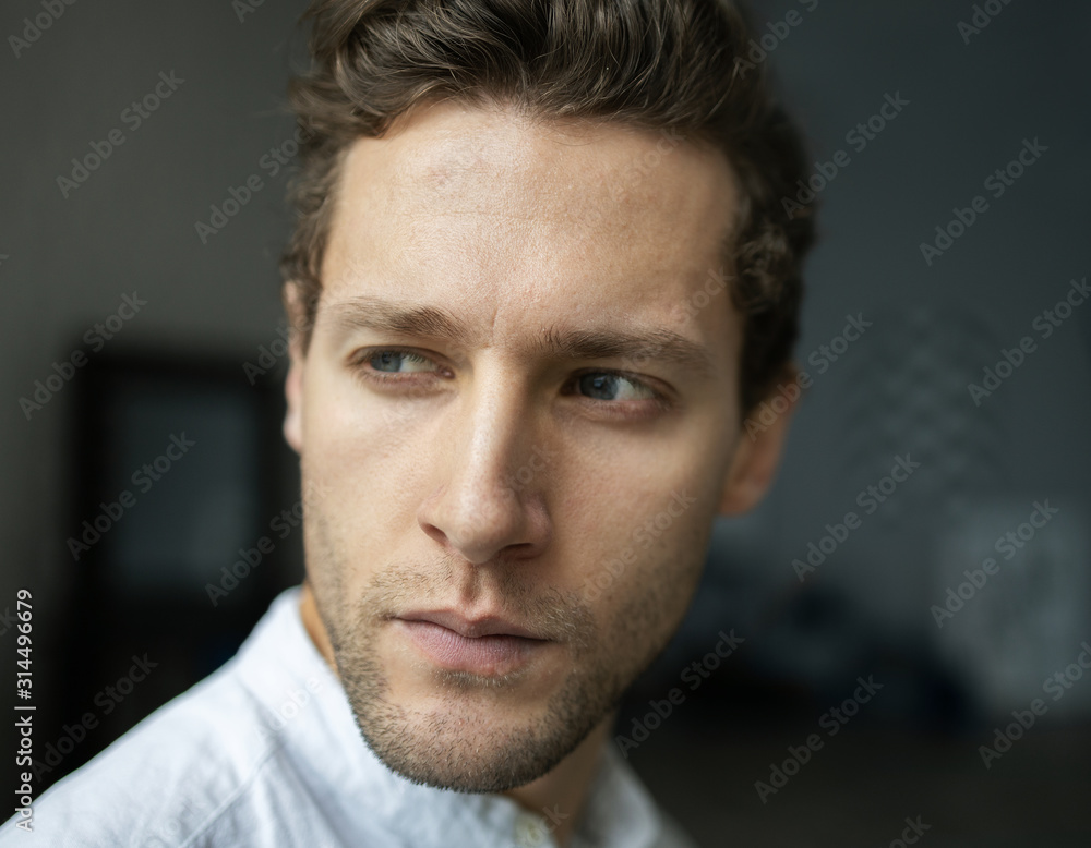 Obraz premium Portrait of young confident man looking aside serious. Handsome milennial well-dressed good-looking attractive businessman. 