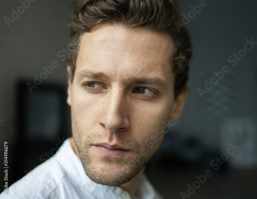 Portrait of young confident man looking aside serious. Handsome milennial well-dressed good-looking attractive businessman. 
