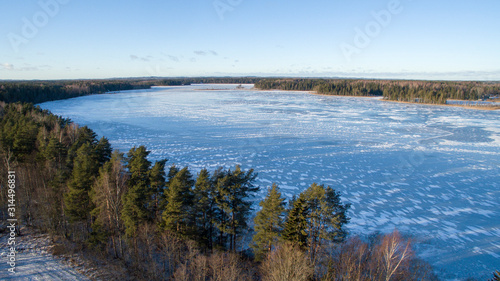Aerial view over frozen lake with ice and snow wall formations, Southern Estonia, Võru county, Lake Hino