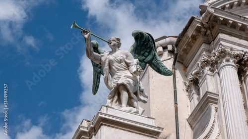 Details of an Angel with a trumpet at the facade of Santa Maria del Giglio church  Santa Maria Zobenigo  in Venice  Italy