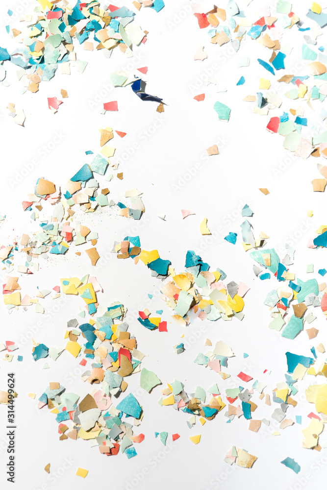 Pieces of eggshell spread over a white background, easter conceptual image, flat lay composition hard natural direct light Pieces of eggshell spread over a white background, easter conceptual image, flat lay composition hard natural direct light