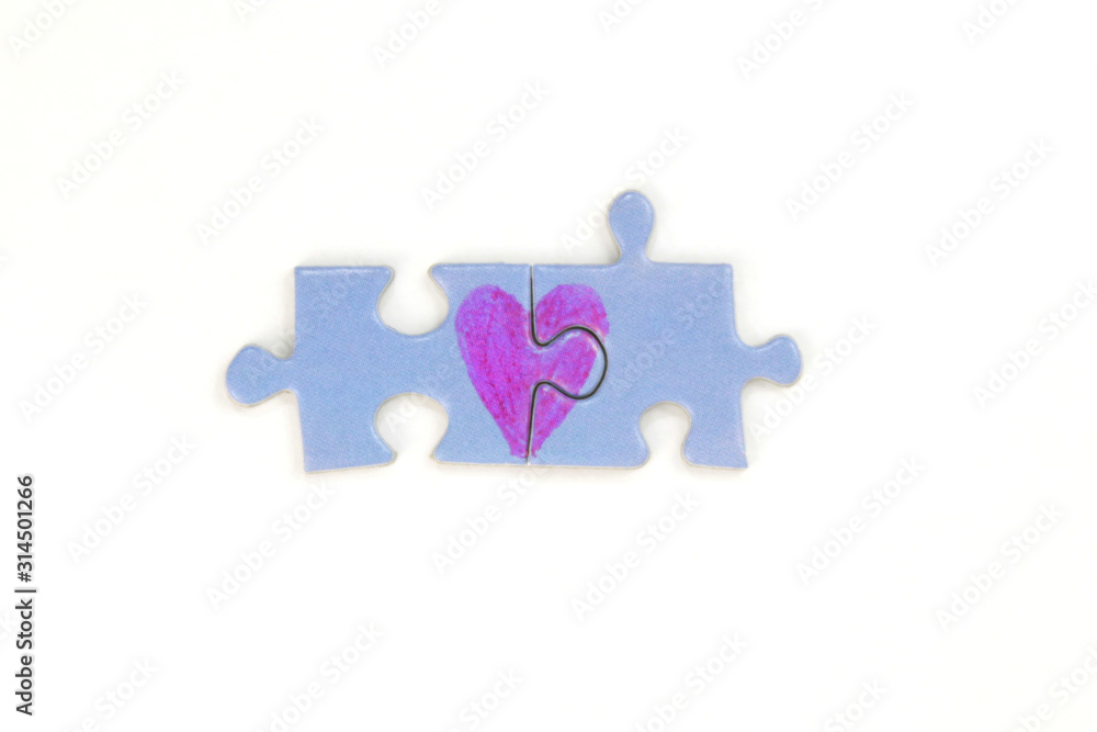 Blue puzzle with a red heart on the white isolation background. Valentine's day stock photo with empty space for your text. For web, print, postcard, background and wallpaper Blue puzzle with a red heart on the white isolation background. Valentine's day stock photo with empty space for your text. For web, print, postcard, background and wallpaper