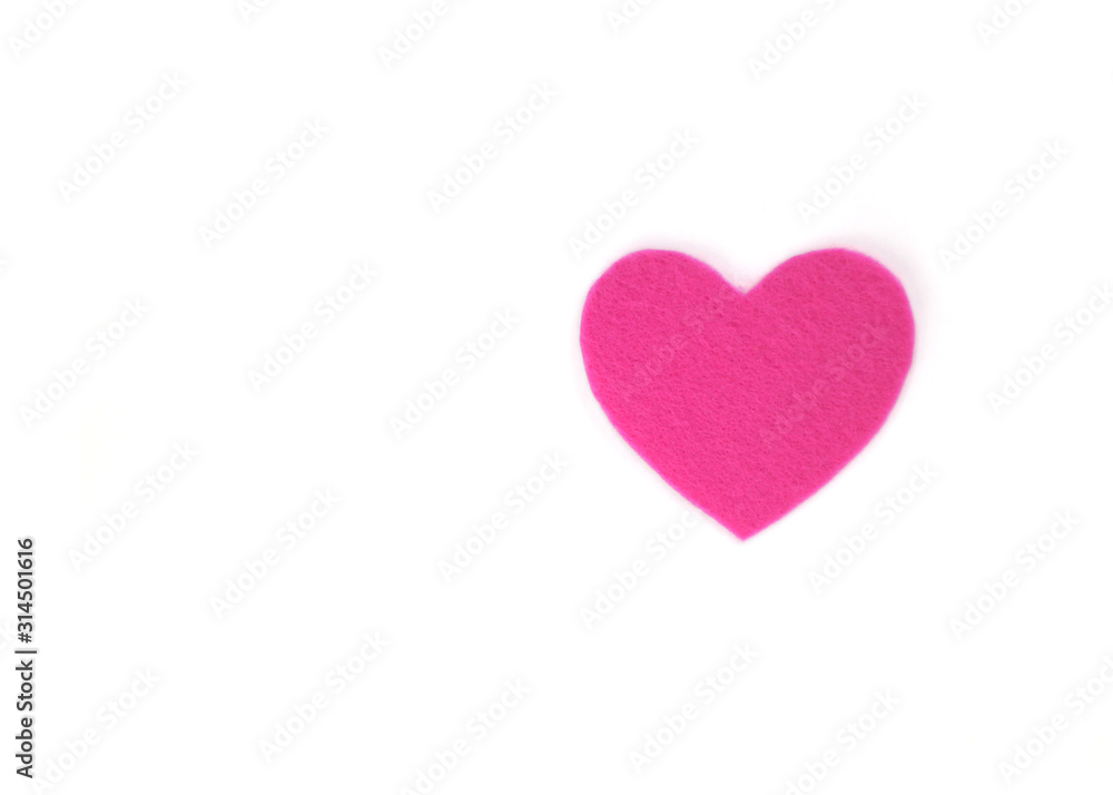 Оne pink felt heart on a white isolated background. Stock photo for the day of St. Valentine with empty space for your text. For web, print, postcards and wallpaper.