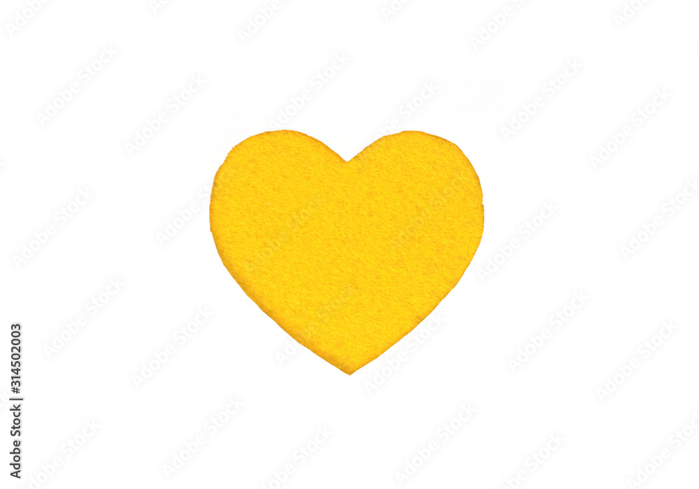 Оne felt yellow heart on a white isolated background. Stock photo for the day of St. Valentine with empty space for your text. For web, print, postcards and wallpaper. Оne felt yellow heart on a white isolated background. Stock photo for the day of St. Valentine with empty space for your text. For web, print, postcards and wallpaper.