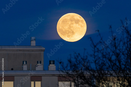 Full moon above a building