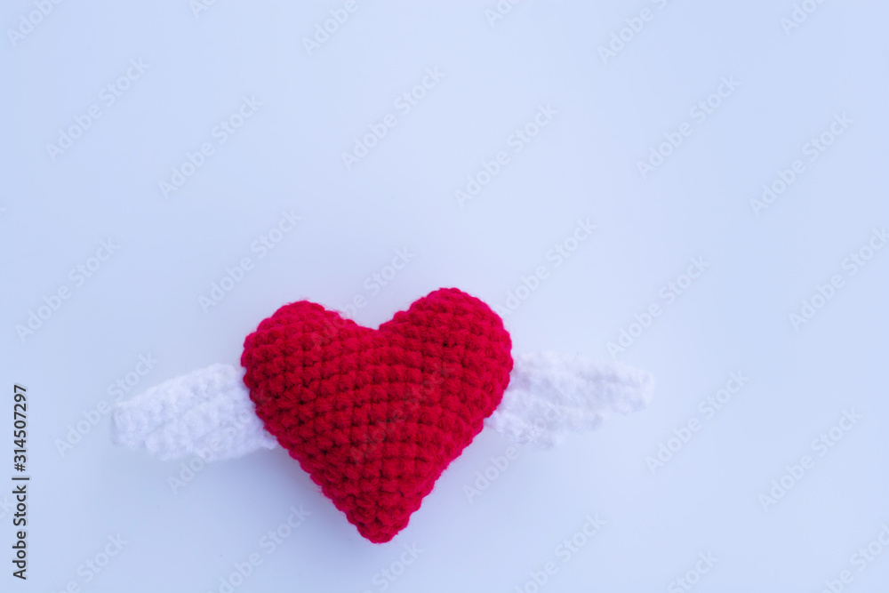 Fototapeta premium Beautiful red heart on a natural bokeh background. Valentine's Day .