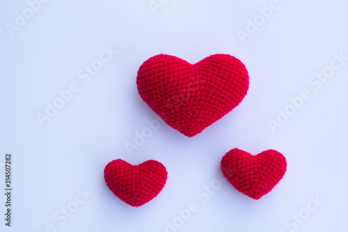 Beautiful red heart on a natural bokeh background. Valentine s Day .