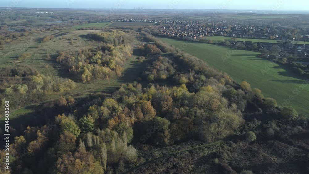 Aerial drone country park fields next to housing estate yorkshire Aerial drone country park fields next to housing estate yorkshire