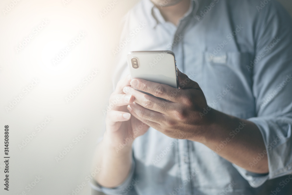 using cell phone.hand holding texting message on screen mobile chatting friend ,search internet information sitting on sofa in office.technology device contact communication connecting people concept using cell phone.hand holding texting message on screen mobile chatting friend ,search internet information sitting on sofa in office.technology device contact communication connecting people concept