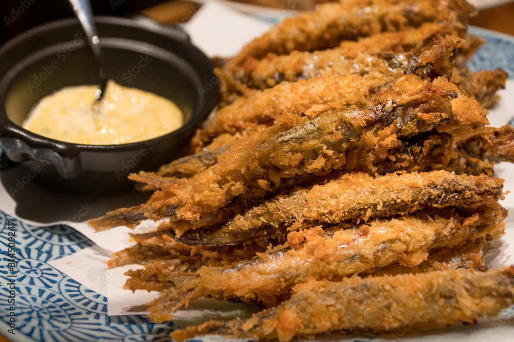 Capelin deep-fried serving with white sauce, Japanese food 