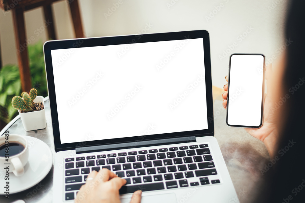 mockup image blank screen computer,cell phone with white background for advertising text,hand man using laptop texting mobile contact business search information on desk in office.marketing,design mockup image blank screen computer,cell phone with white background for advertising text,hand man using laptop texting mobile contact business search information on desk in office.marketing,design