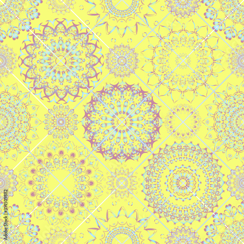 Seamless pattern. Round patterns located at the grid nodes are geometrically symmetrical. Floral motifs, delicate pink-blue shades on yellow. Wallpaper in the nursery, fabric for clothes, curtains.