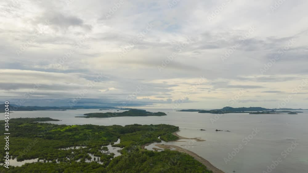 Tropical islands during sunset, aerial drone Hyperlapse. Caramoan Islands, Philippines. Seascape in the evening. Tropical islands during sunset, aerial drone Hyperlapse. Caramoan Islands, Philippines. Seascape in the evening.