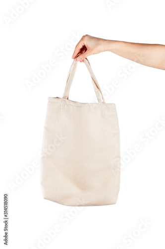 Woman with cotton eco bag over white backgound. Ecology or environment protection concept. White eco bag for mock up