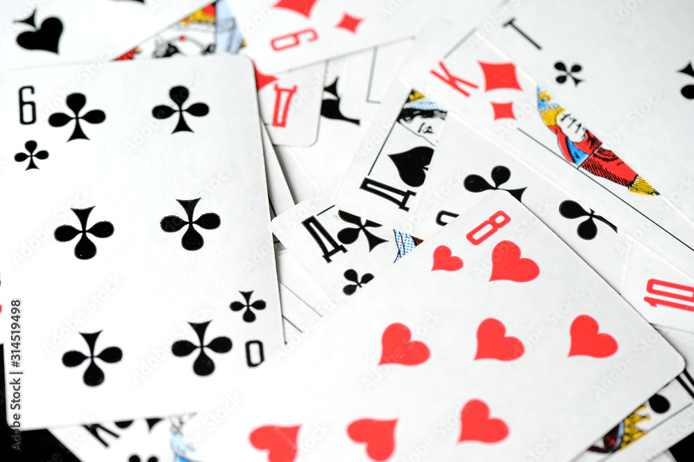 Playing cards on a black background close-up. Gambling Concept Playing cards on a black background close-up. Gambling Concept