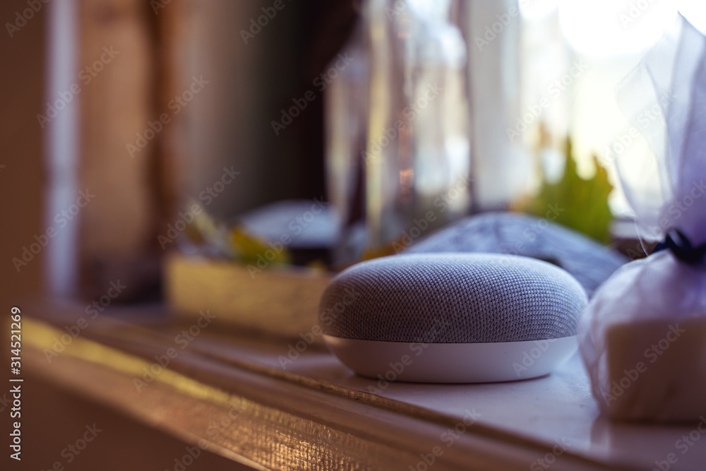 voice controlled smart speaker in a interior home environment. Smart home ai concept voice controlled smart speaker in a interior home environment. Smart home ai concept