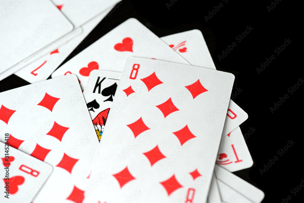 Playing cards on a black background close-up. Gambling Concept Playing cards on a black background close-up. Gambling Concept