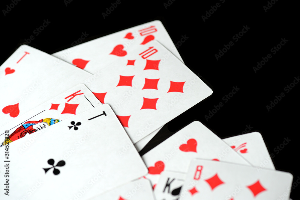 Playing cards on a black background close-up. Gambling Concept Playing cards on a black background close-up. Gambling Concept