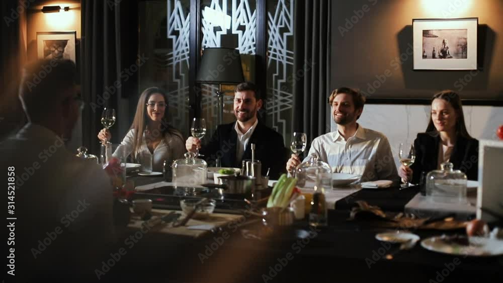 Guests At Chef's Cooking Class At Restaurant. Enthusiastically Listening.