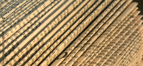 Abstract folded old paper with English text
