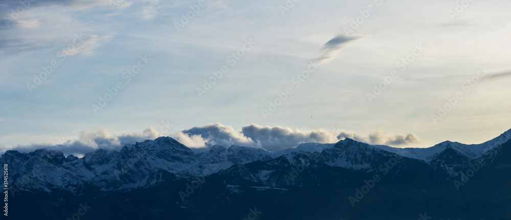 Plakat High mountains under snow in the winter. Panorama